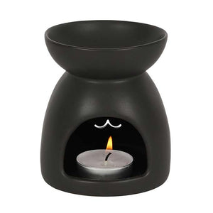 
                  
                    Black Cat Cut Out Oil Burner White Background With Tealight Candle Lit
                  
                