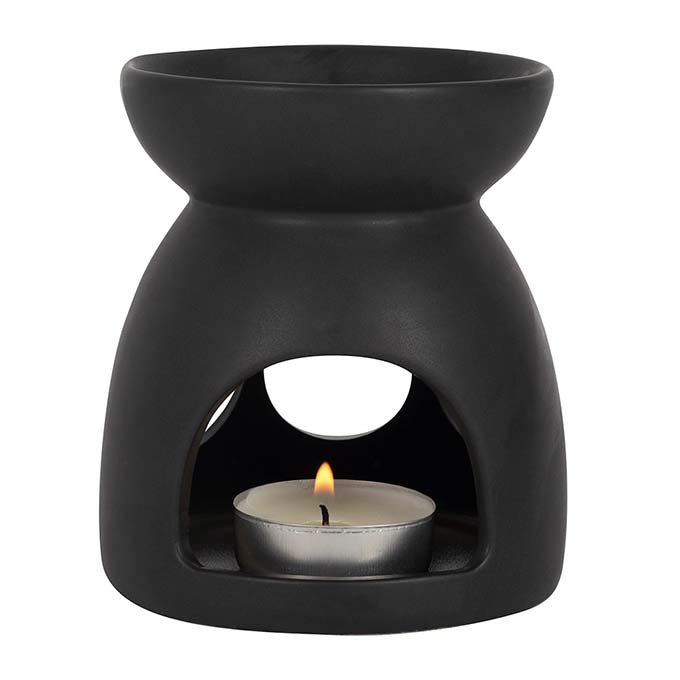 
                  
                    Black Triple Moon Cut Out Oil Burner on White Background showing tealight candle lit
                  
                