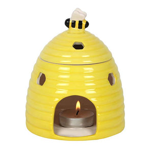
                  
                    Yellow Beehive Oil Burner With Candle Lit Inside
                  
                